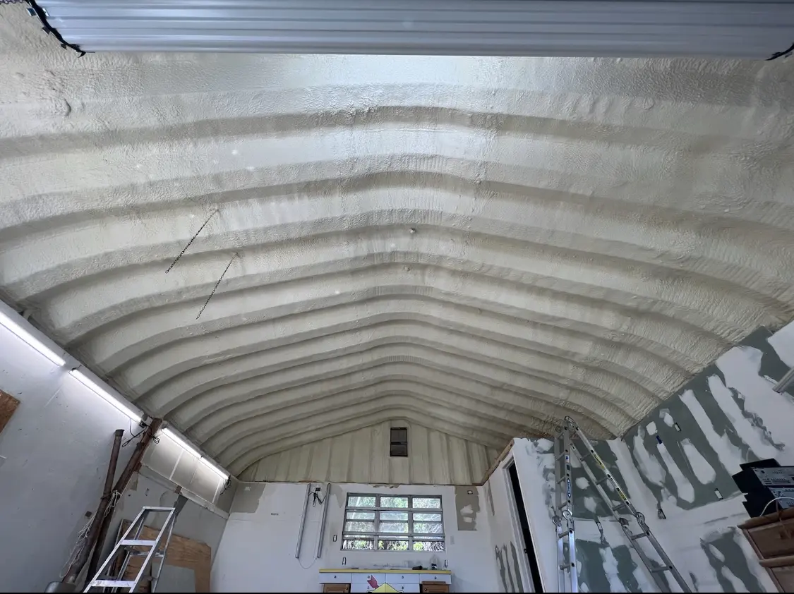 Spray polyurethane foam applied to the underside of a metal roof deck in Dock Junction